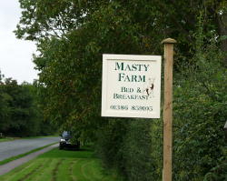 Entrance sign at beginning of driveway