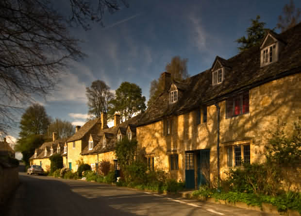 The hillside village of Snowshill perching on the edge of the Cotswold escarpment overlooking Broadway and Evesham