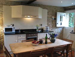 This charming period cottage has flagstone floors, a beautiful open wood fire and a fully fitted modern kitchen dining room; with dishwasher, washing machine, microwave and not forgetting the Rayburn Royal Range Stove